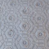 White bed throw with relief embroidery and floral patterns