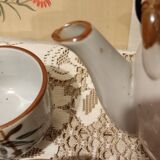Asian set of a teapot and its cups
