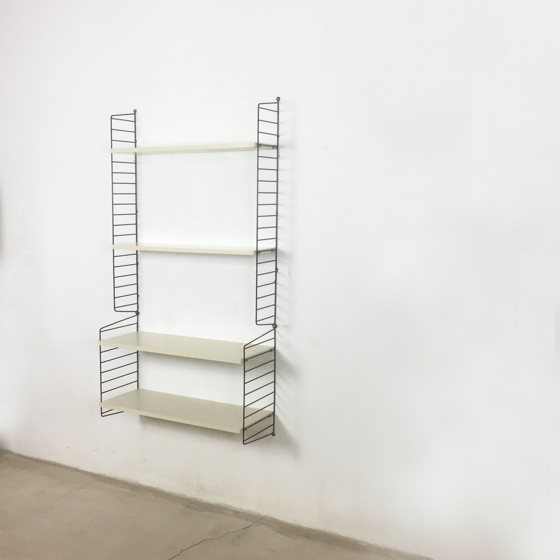 Swedish white shelves by Nisse Strinning for String of the 1960s