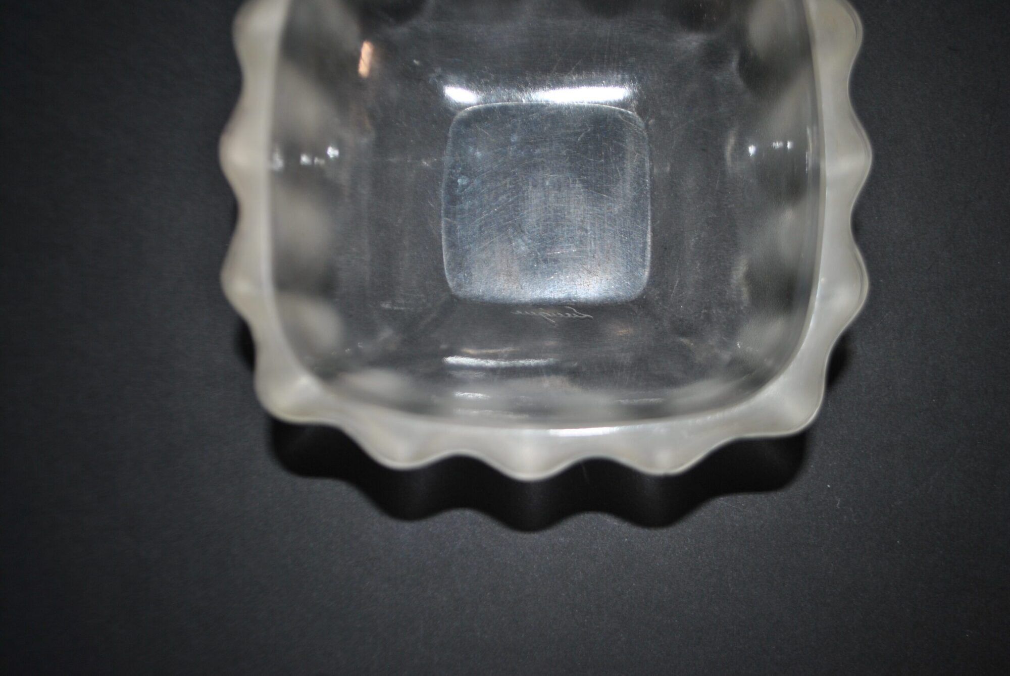 Lalique glass ashtray bowl with frosted finish, engraved with wave design, signed Lalique.
