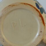 Old pitcher, pot to ance, faience, floral decoration.
