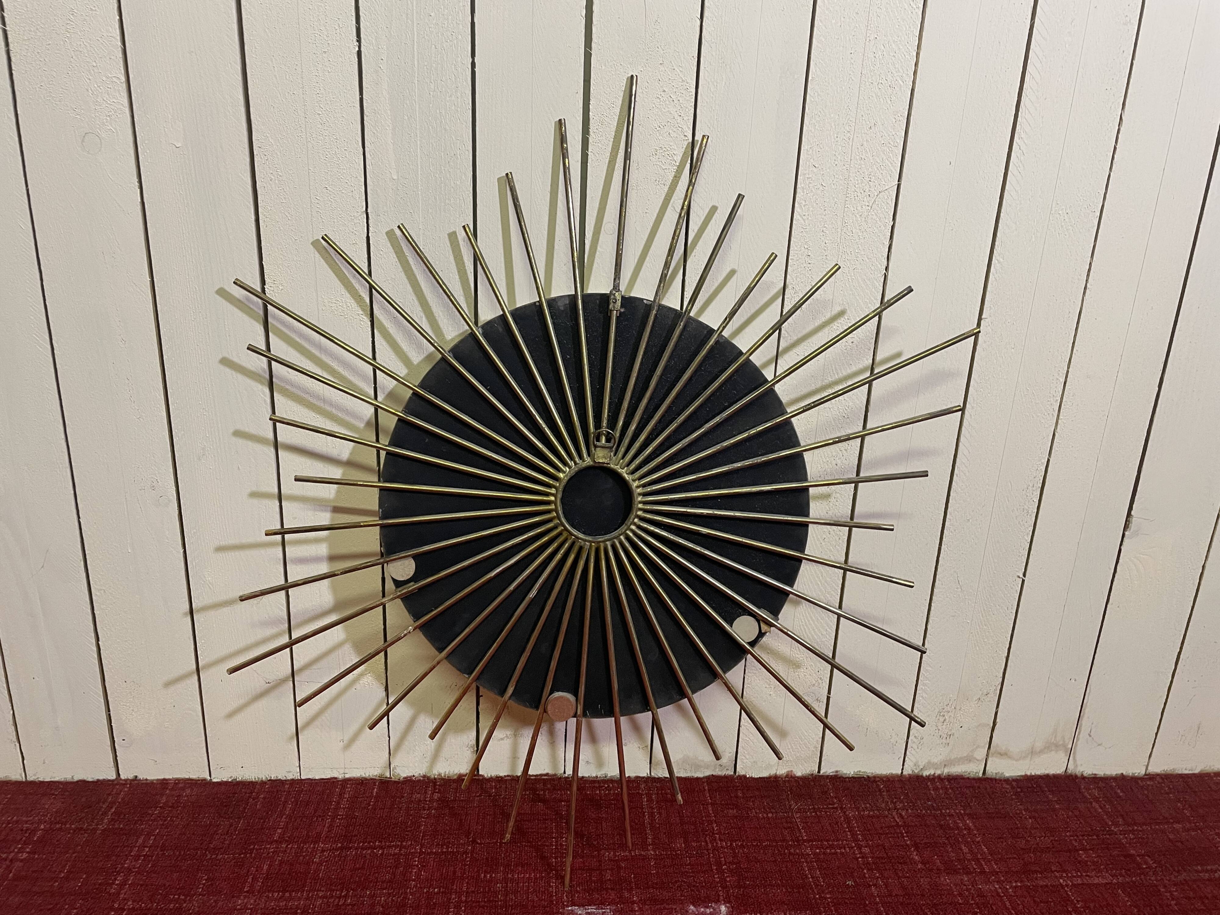 Golden metal sun mirror year 60