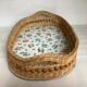 Old wicker basket tray with wooden beads.