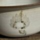 Small thick stoneware bowl with a stylised flower pattern in white on the outside, b