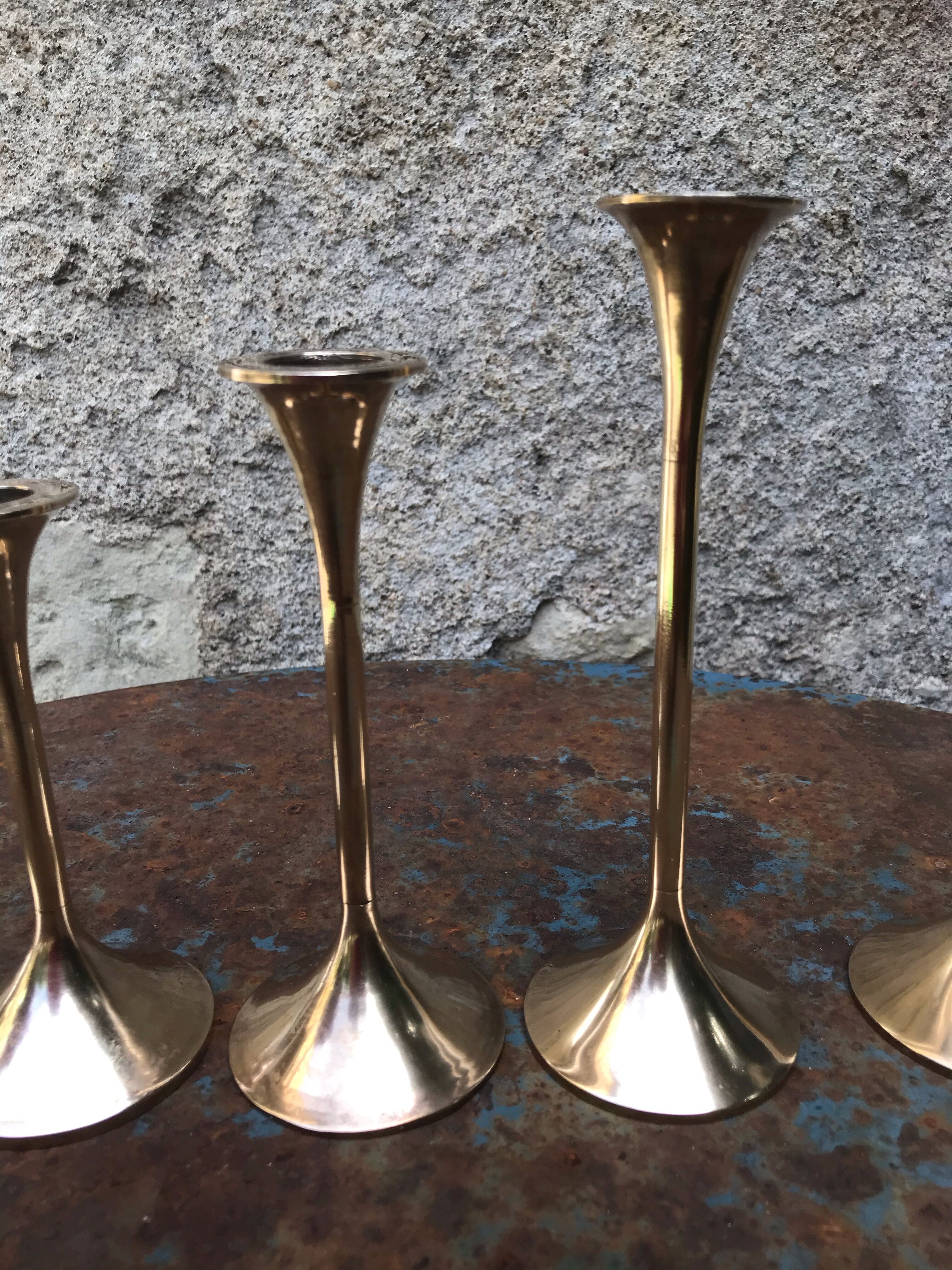 Series of 5 brass candlesticks