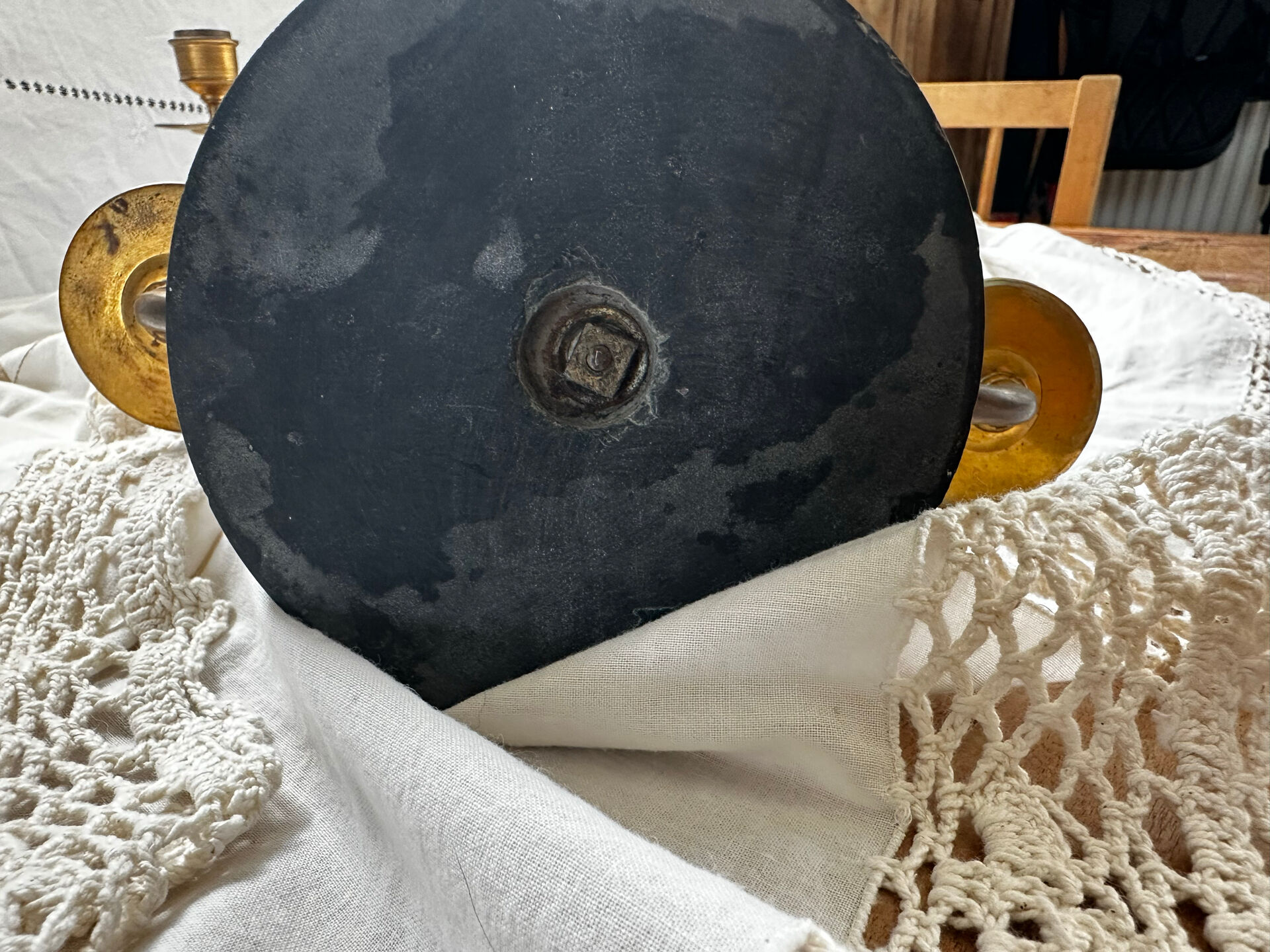 Pair of Empire style candlesticks, patinated brass and black stone.