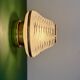 Vintage Art Deco globe wall/ceiling light in white, black, and gold glass.