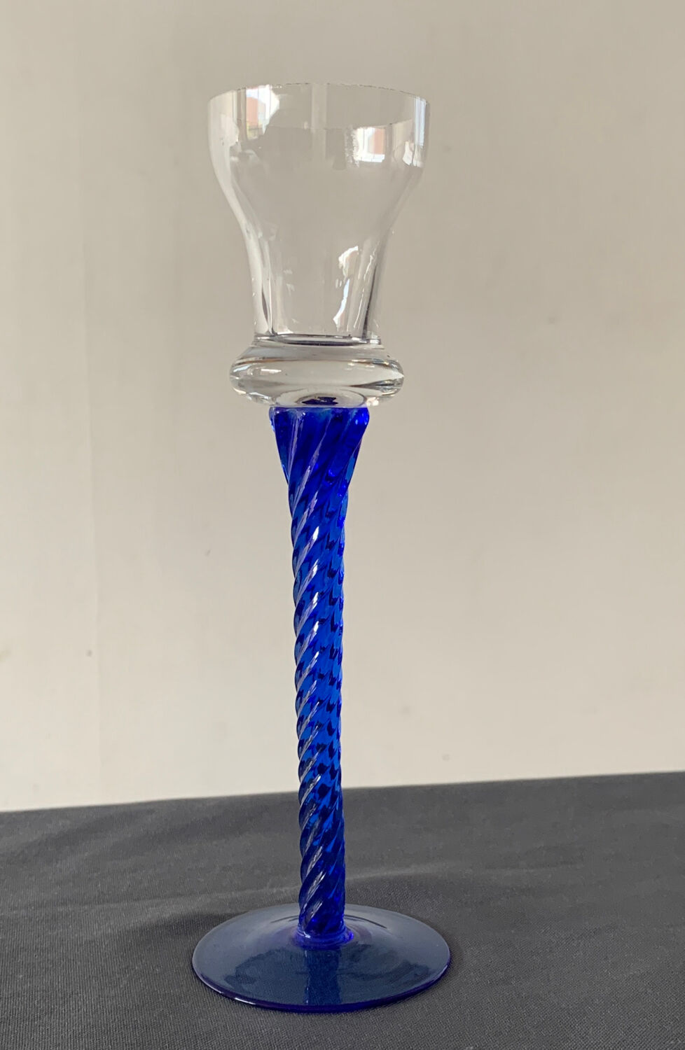Blue glass candle holder with twisted stem. Candlestick candle