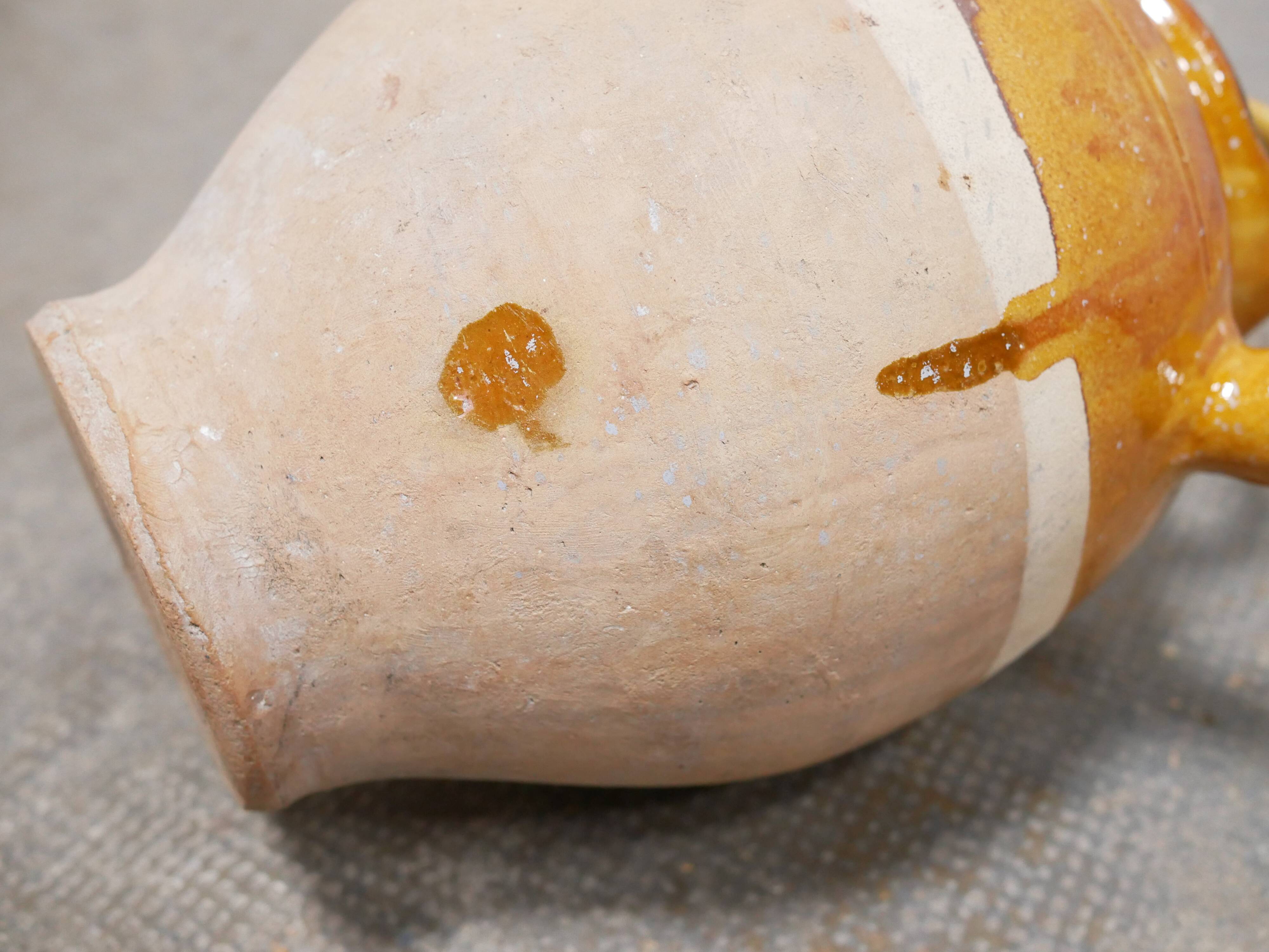 Old gargoulette pot in glazed terracotta