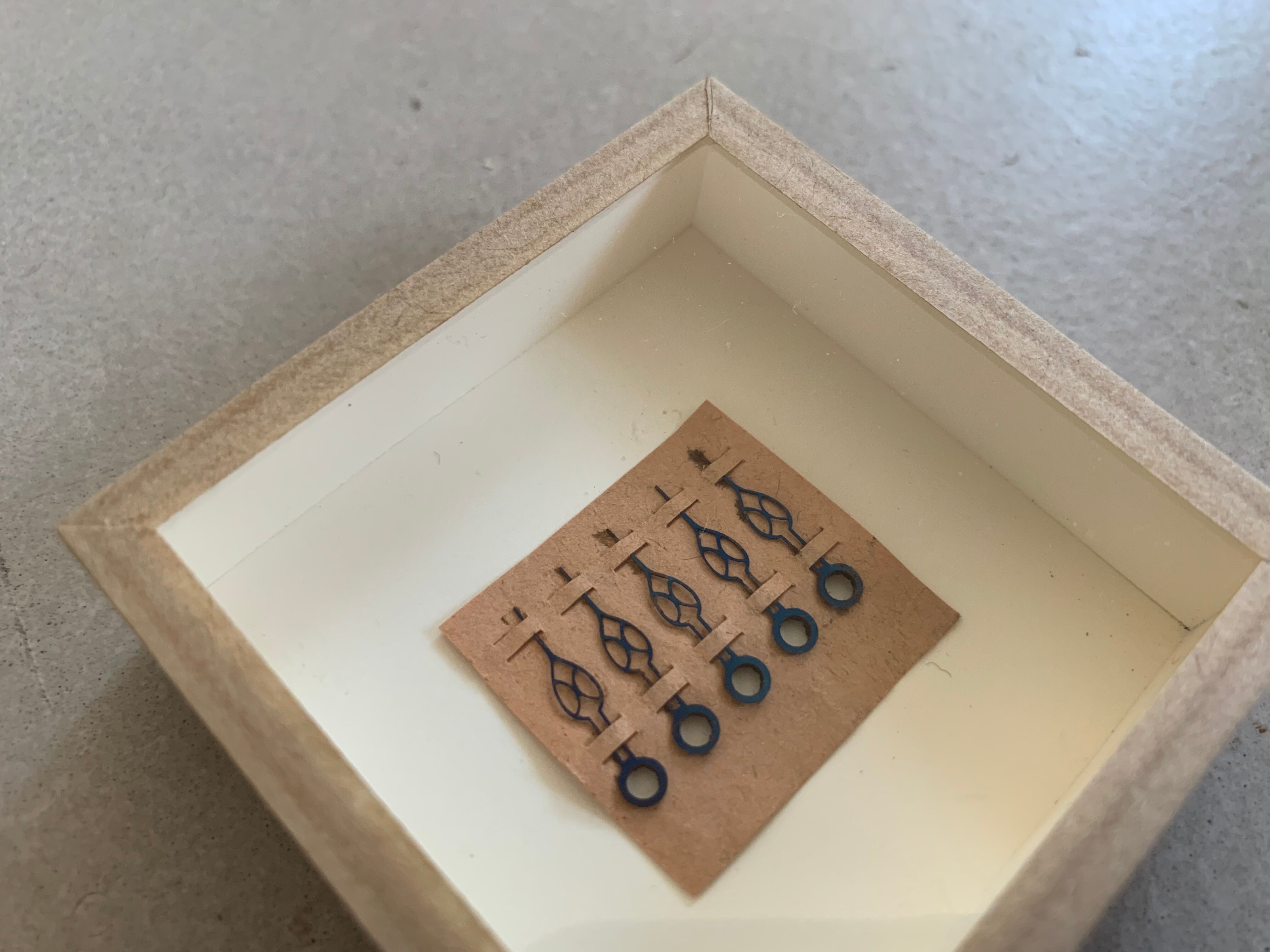 Miniature frame, antique pocket watch hands