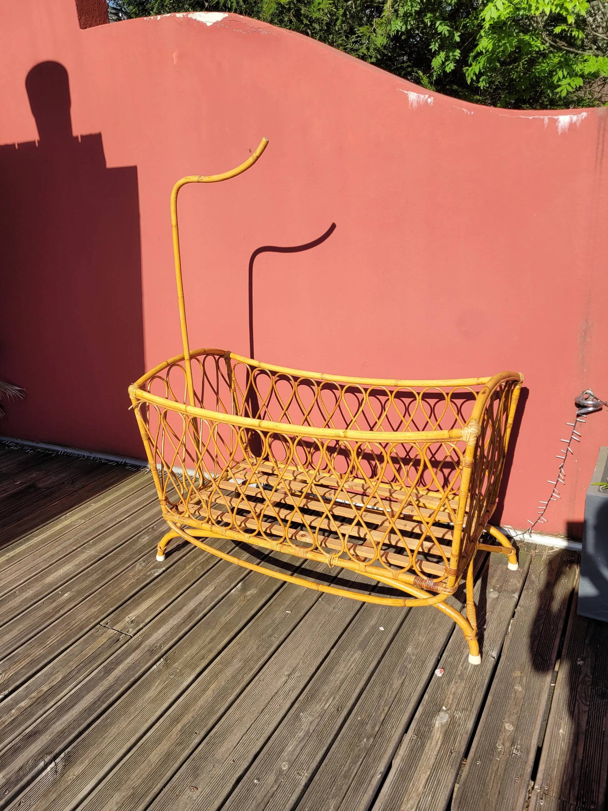 Bamboo and rattan baby cot with canopy.