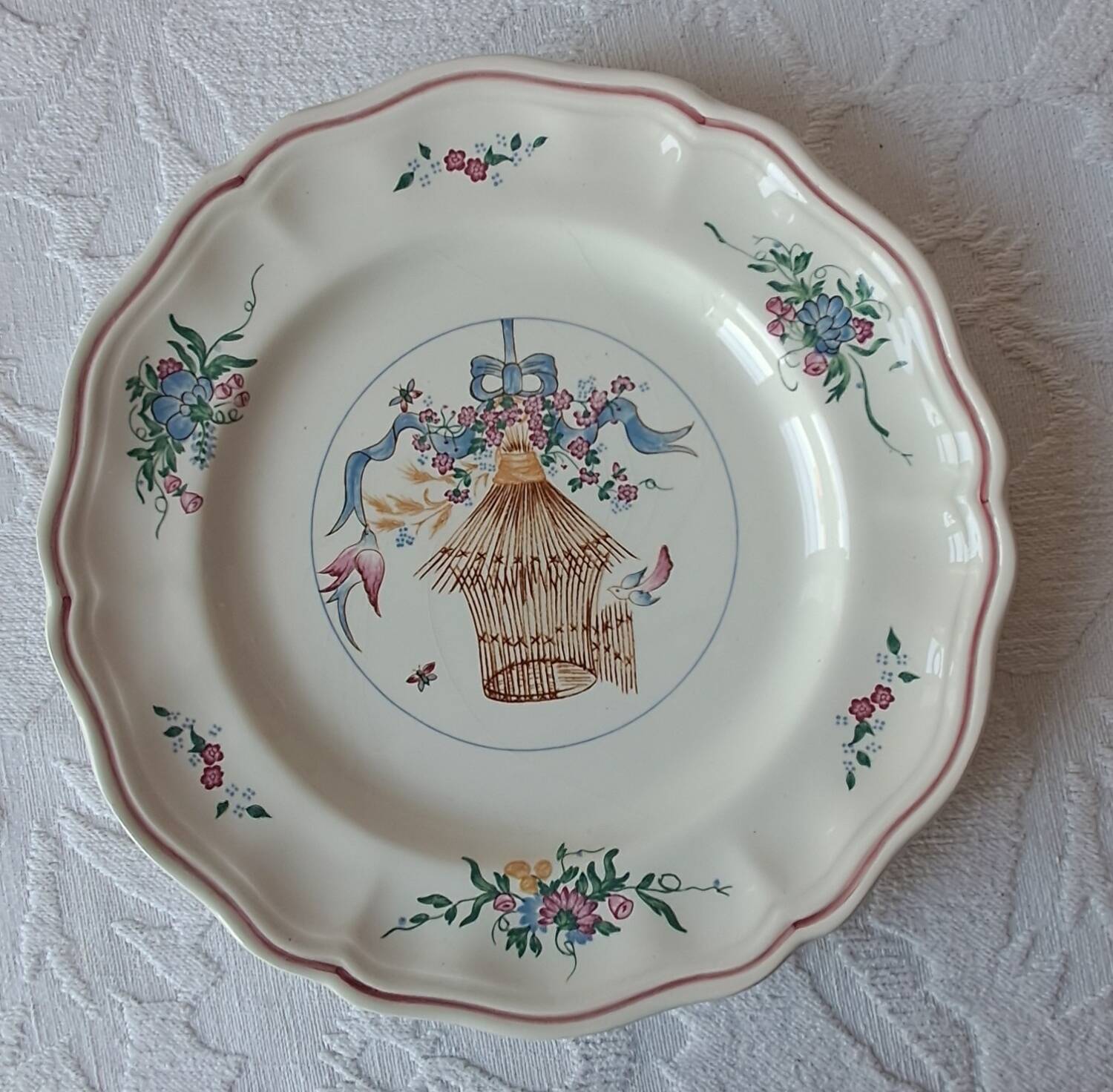 Longchamp earthenware plate. Birdcage decoration