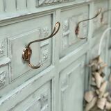 Cloakroom with sage green wall coats