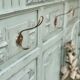 Cloakroom with sage green wall coats