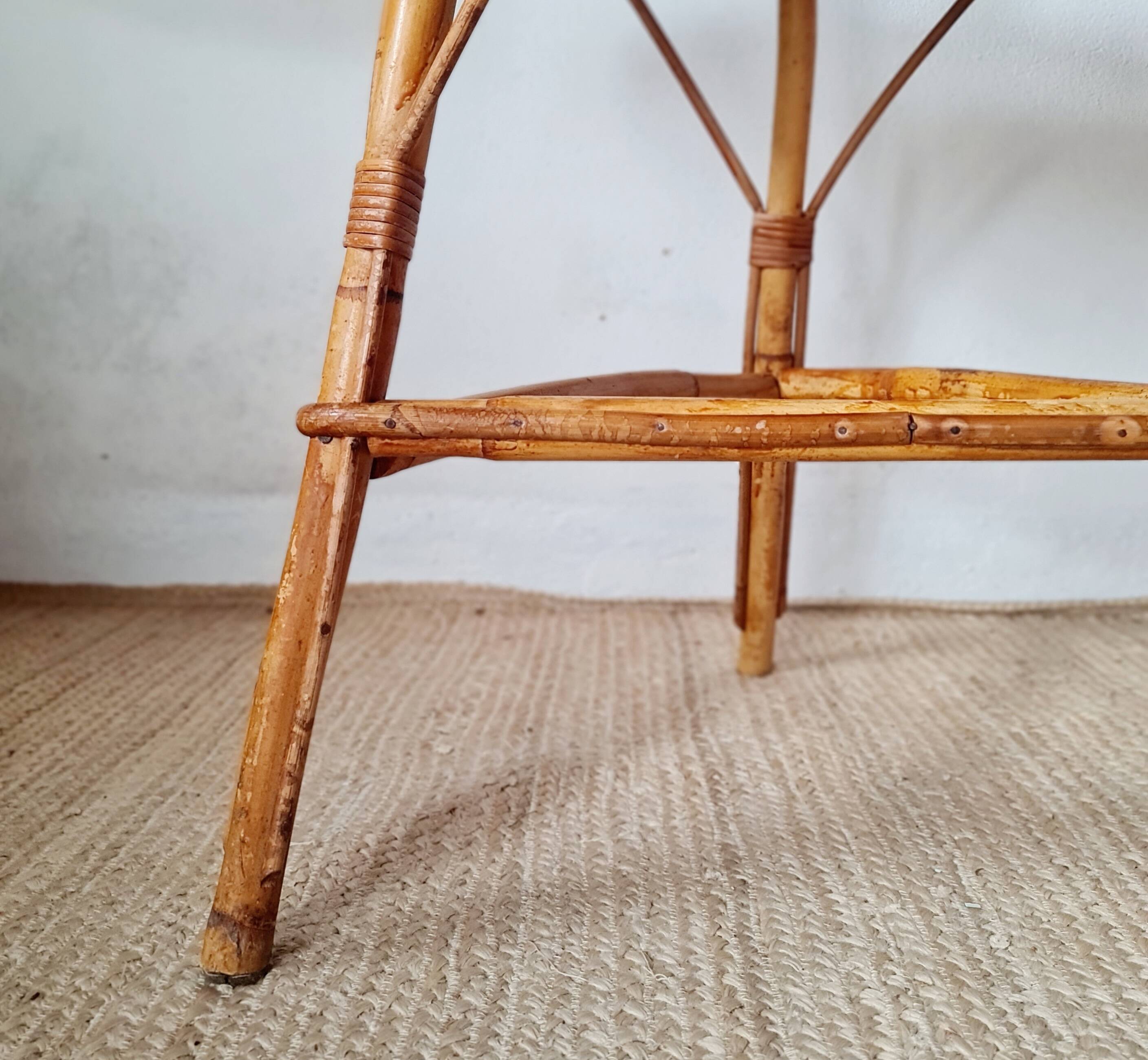 Round soft pink rattan table