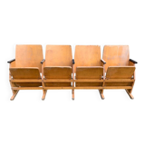 Vintage cinema bench for four people, brown varnished beech in Mid-Century style from the 1950s.