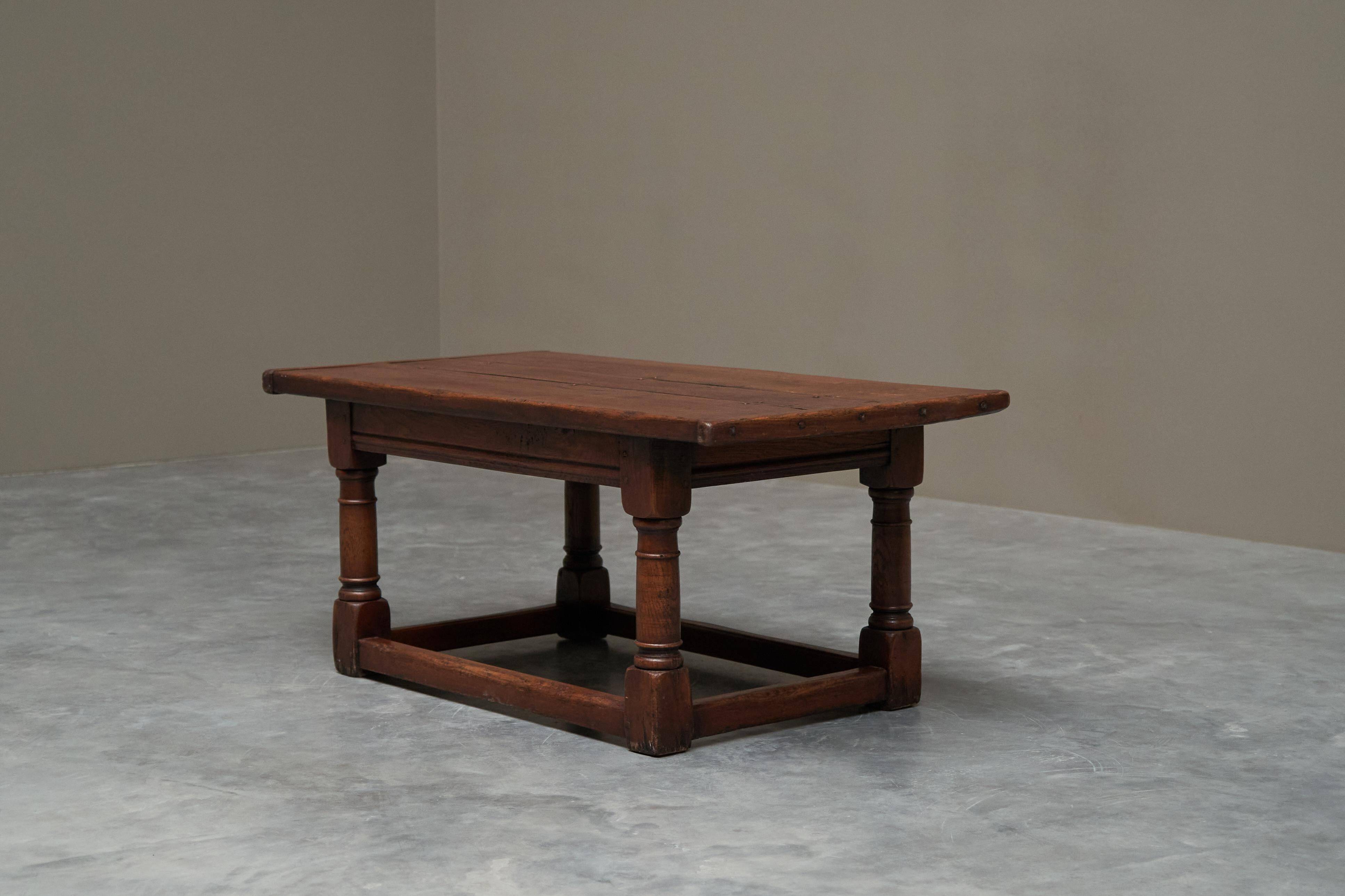 Antique solid oak coffee table in refectory style, 19th century.
