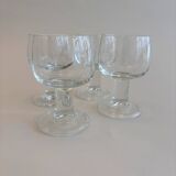 Set of 4 stemmed glasses. In good condition with some signs of wear.