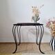 Small coffee table from the 1950s in wrought iron and glazed ceramic.