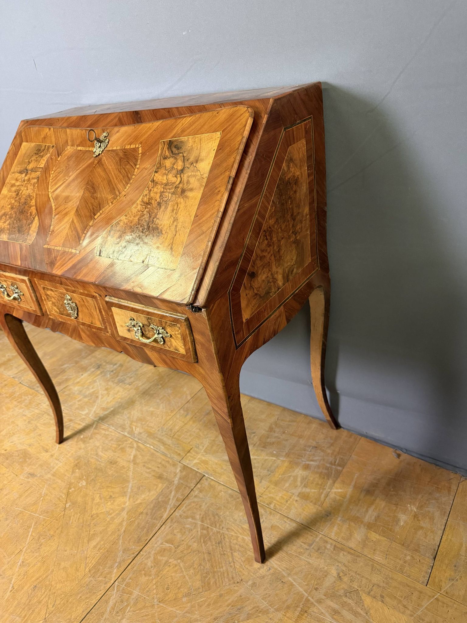 Louis XV slant-top desk in 18th-century marquetry.