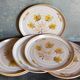 Six assiettes en grès de Niderviller au décor végétal vintages