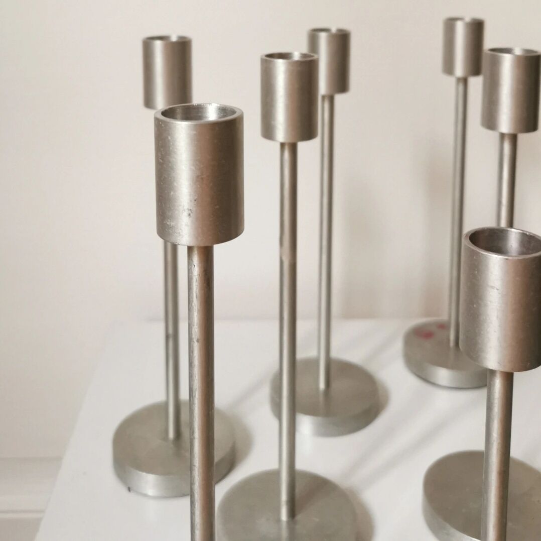 Set of 10 aluminium candle holders.