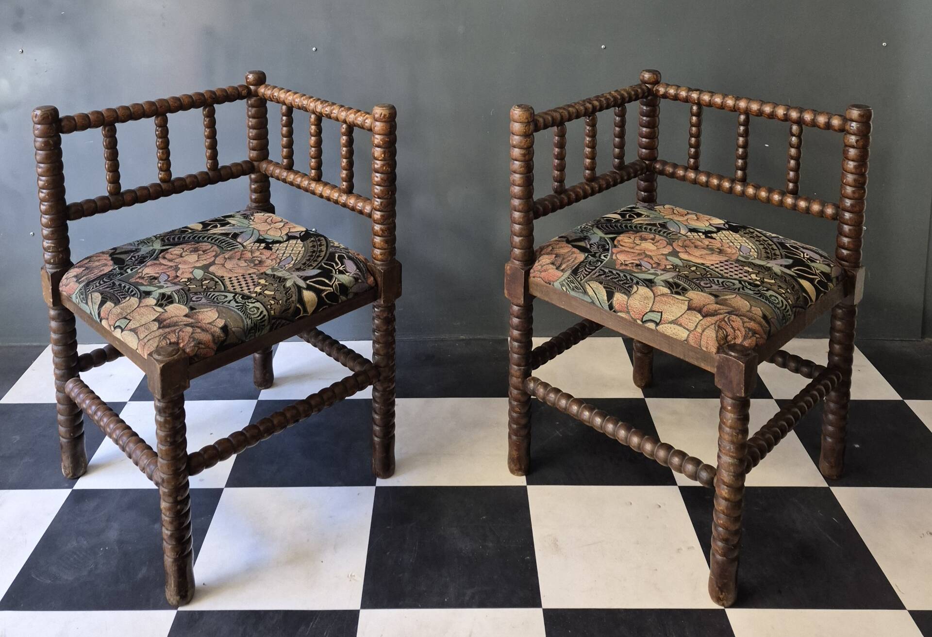 Old pair of corner chairs known as 'fireplace corner' armchairs.