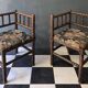 Old pair of corner chairs known as 'fireplace corner' armchairs.