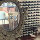 Psyche mirror in brass