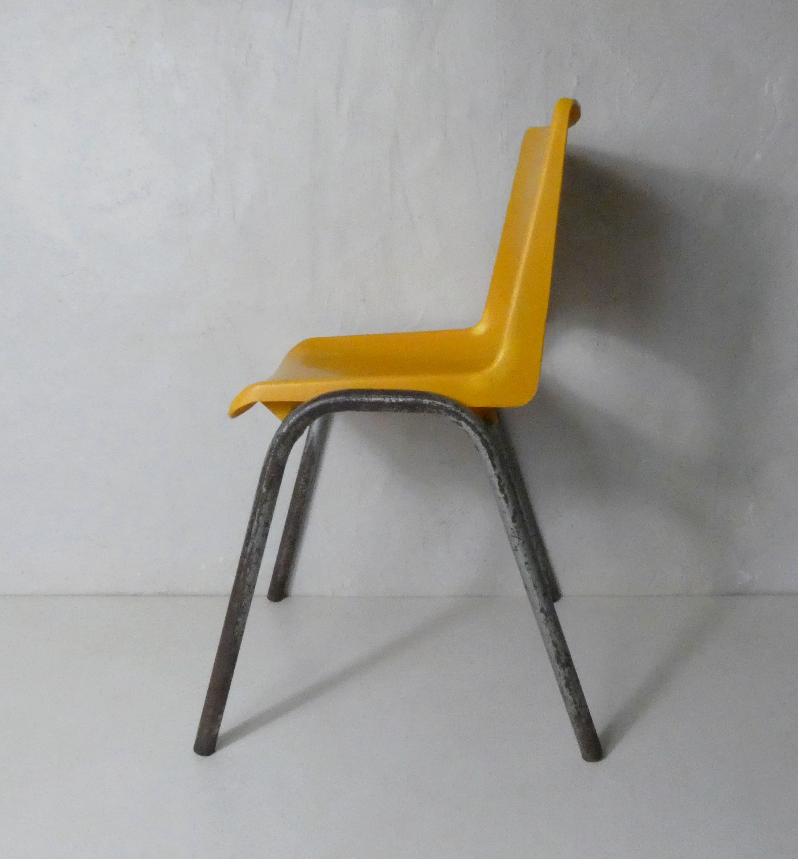 yellow plastic child chair