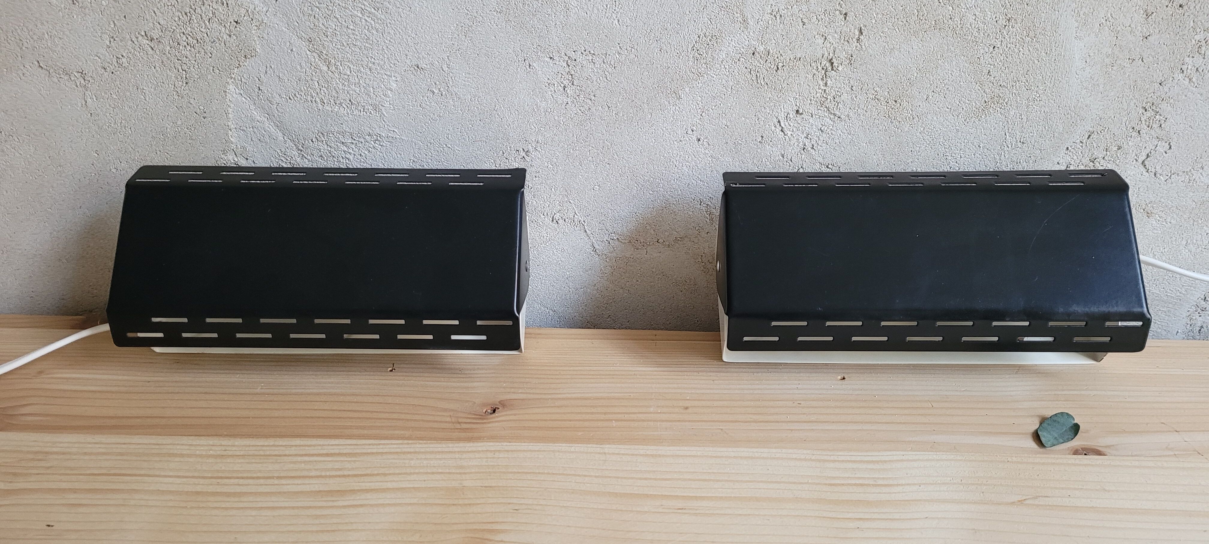 Pair of wall sconces with adjustable shutter