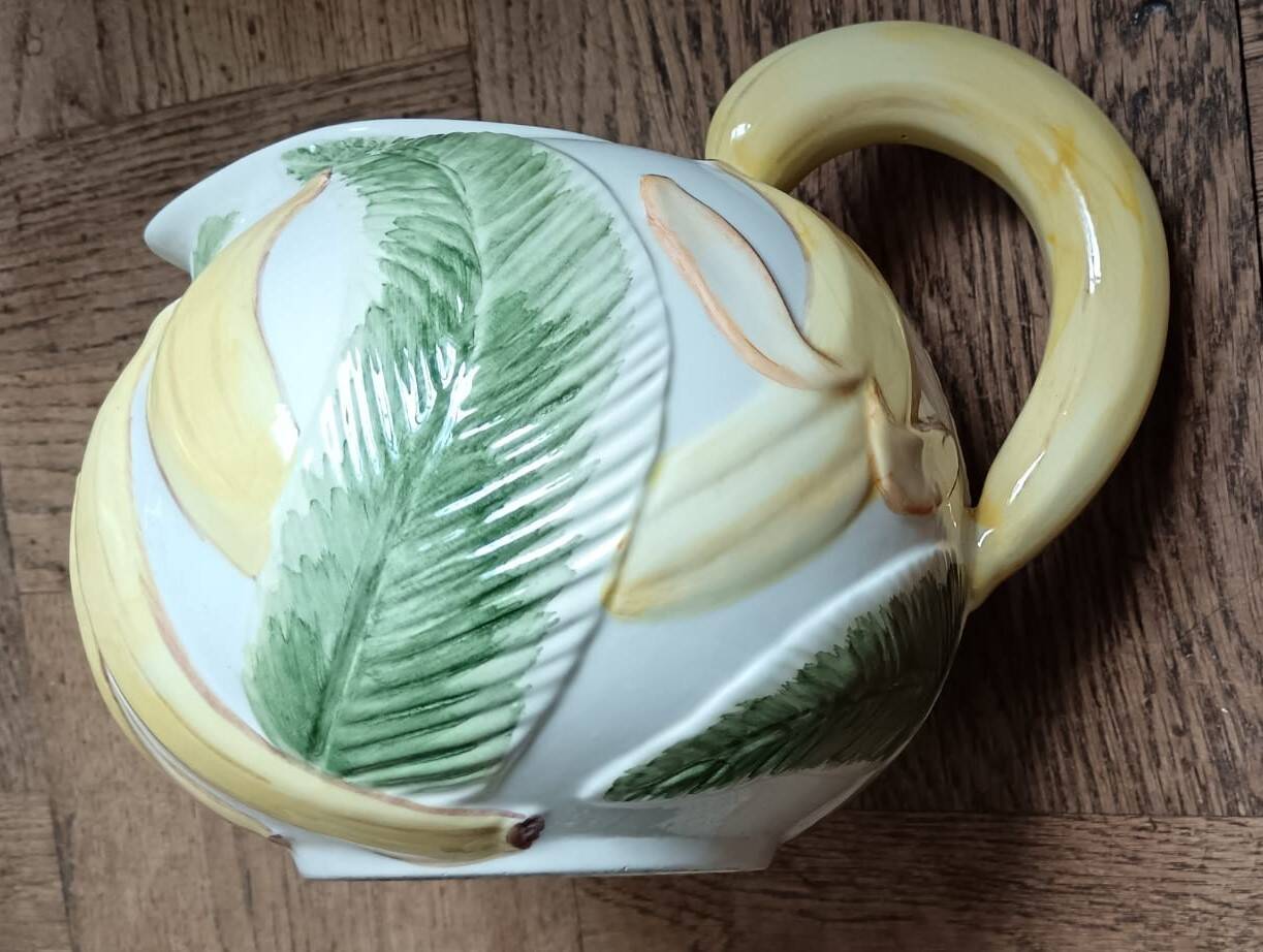 Jug in earthenware with banana decoration.