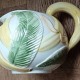 Jug in earthenware with banana decoration.