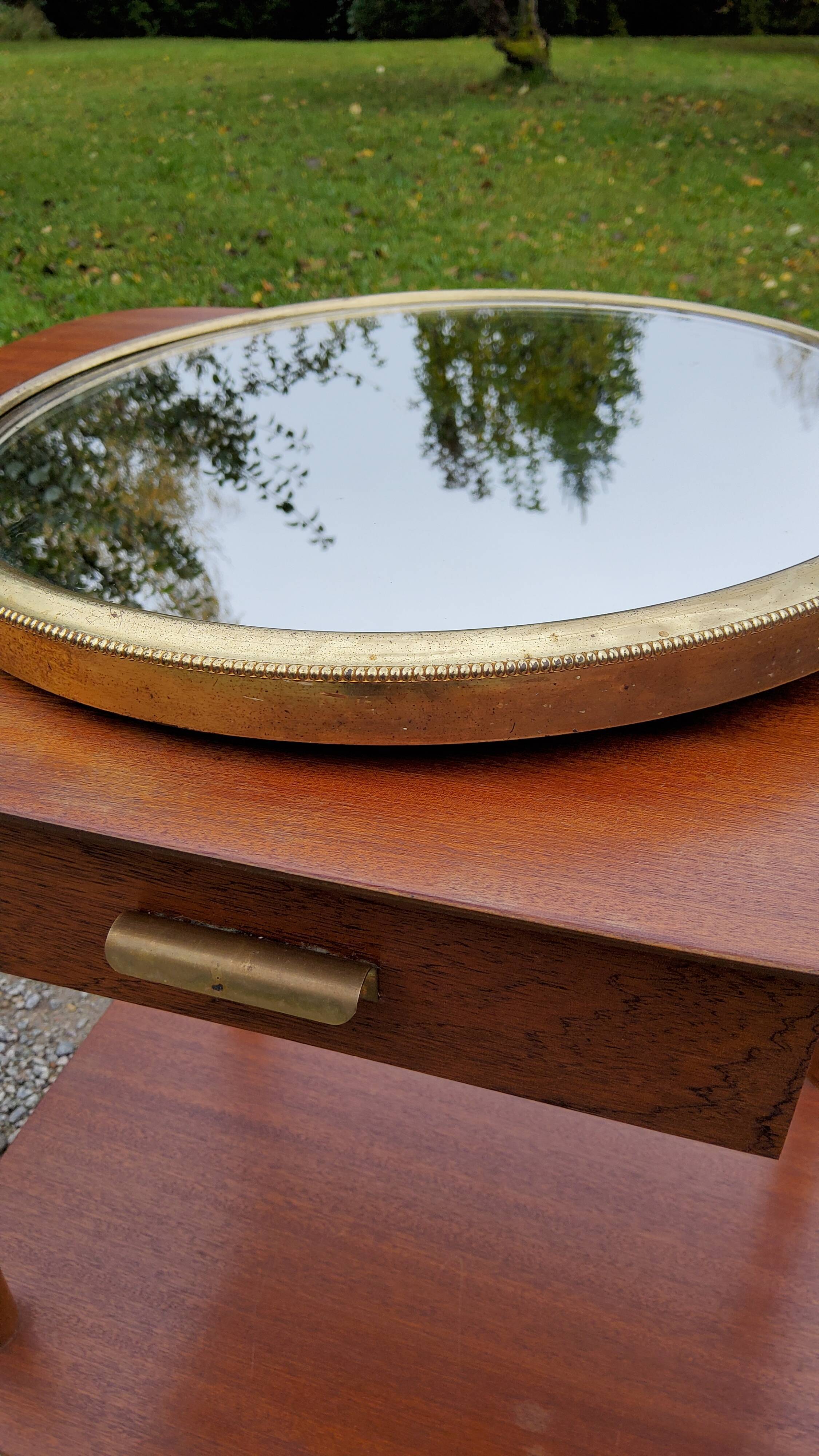 Round mirror of the 50s in gold metal 33cm in diameter