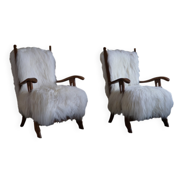 Deux fauteuils en Oak et peau de mouton islandais à poil long, Henning Kjærnulf, 1950