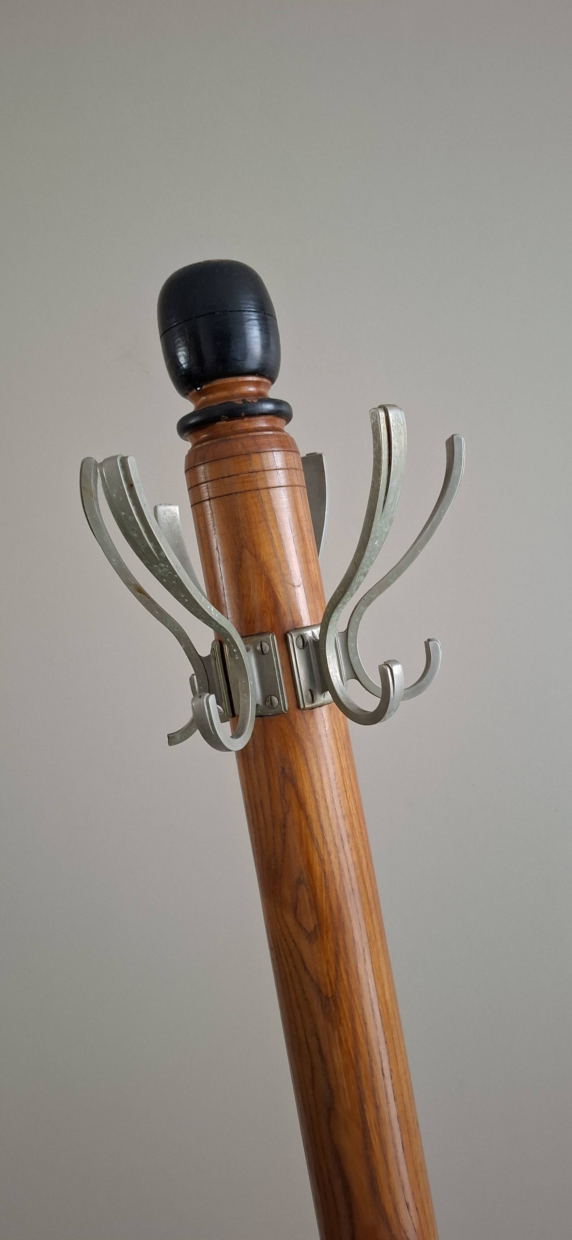 Coat rack on wood and black stand