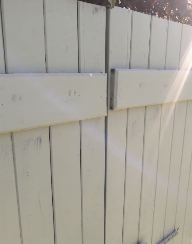 Pair of wooden shutters hanging iron