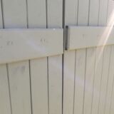 Pair of wooden shutters hanging iron
