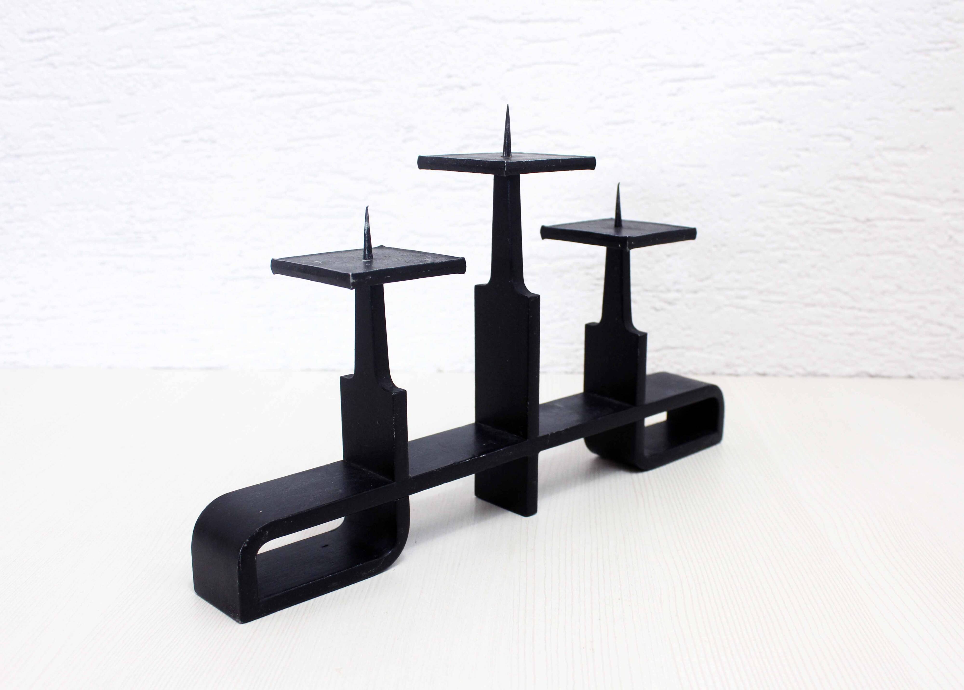 Modernist cast iron candle holder