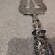 Fish serving fork with 950 silver handle, rococo cherub design
