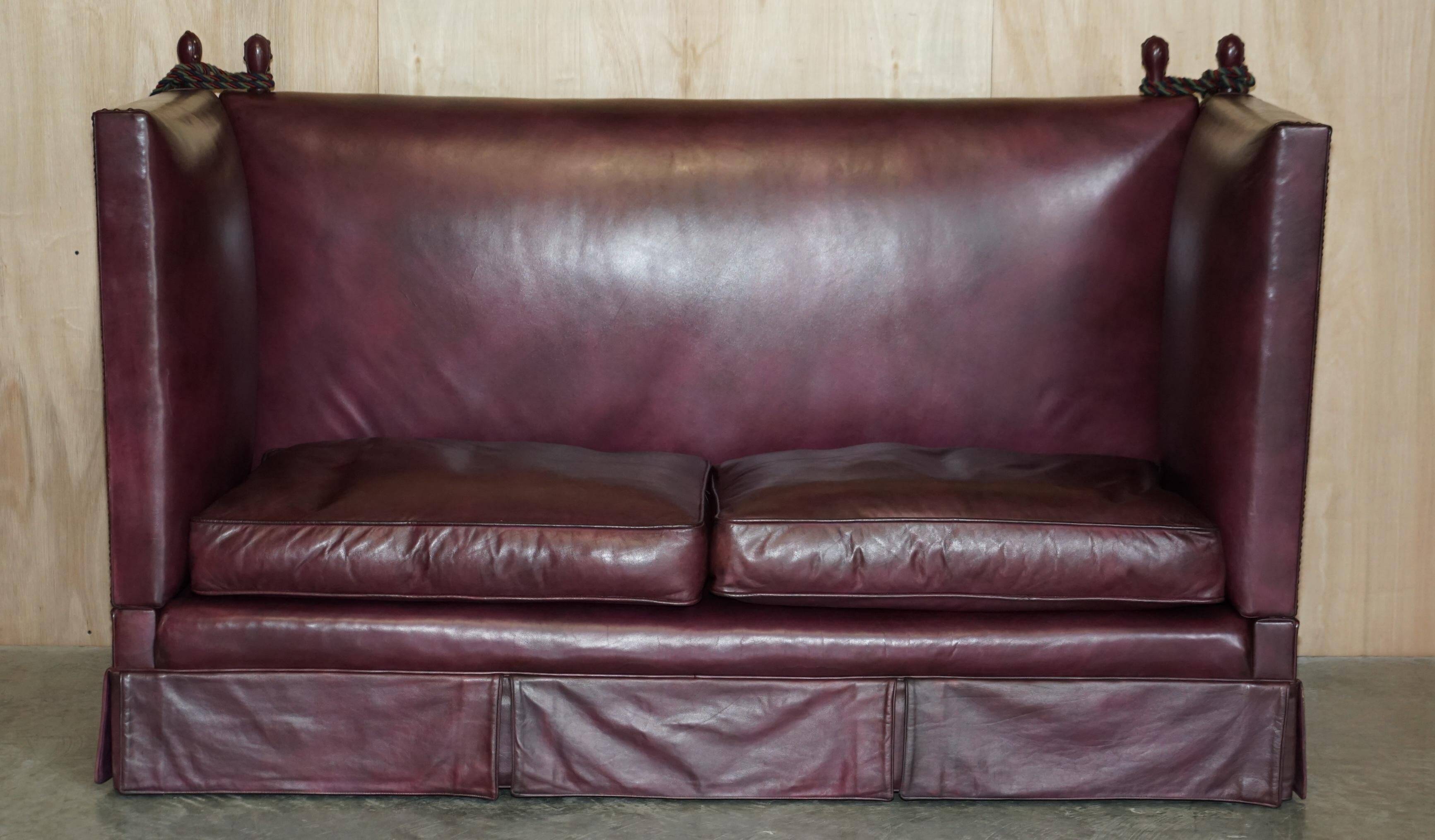 Victorian Knole canapé restored in leather with feather cushions.
