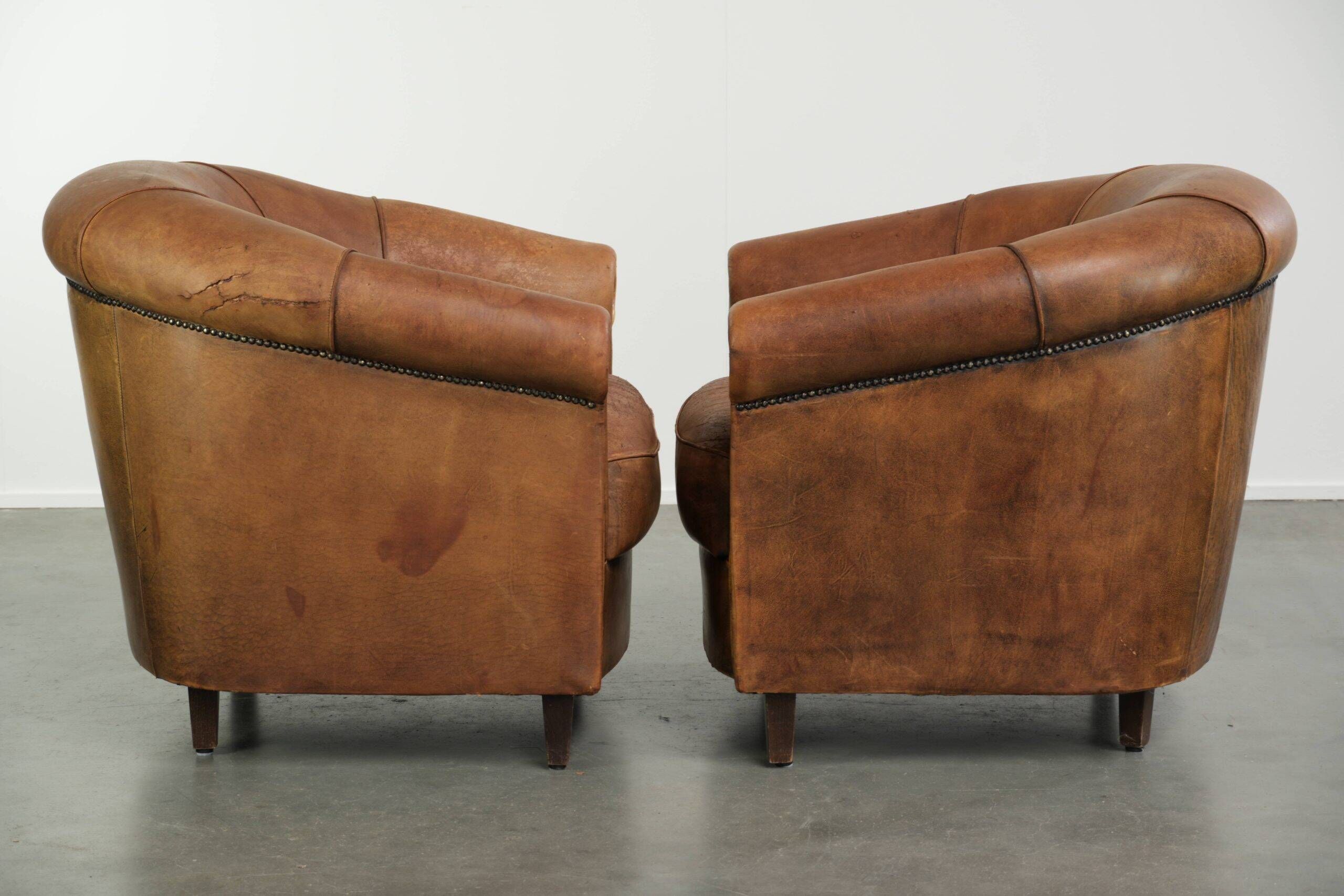 Sturdy set of vintage sheepskin club armchairs with a great appearance