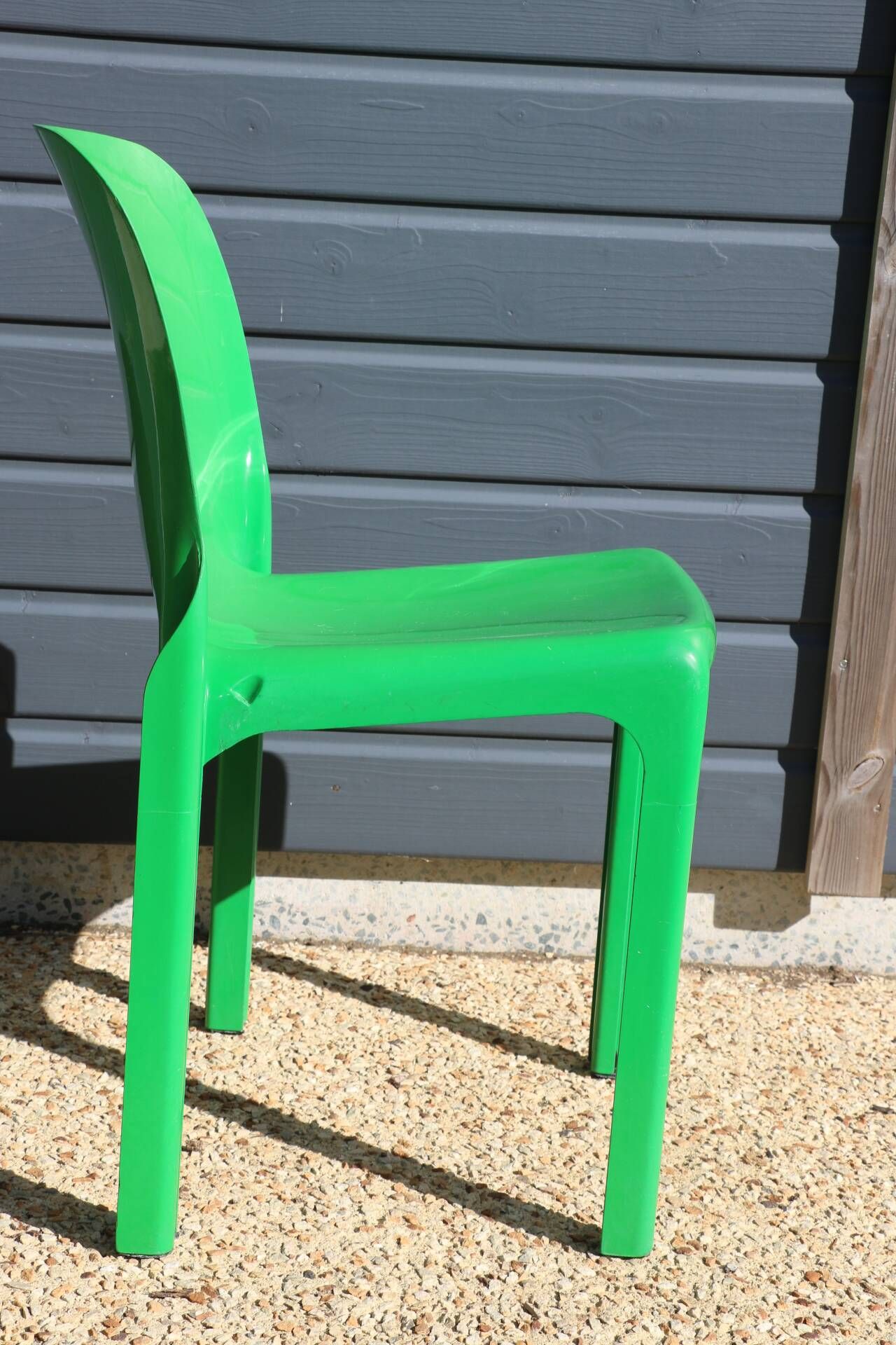 Set of 4 green Selene Magistretti chairs.
