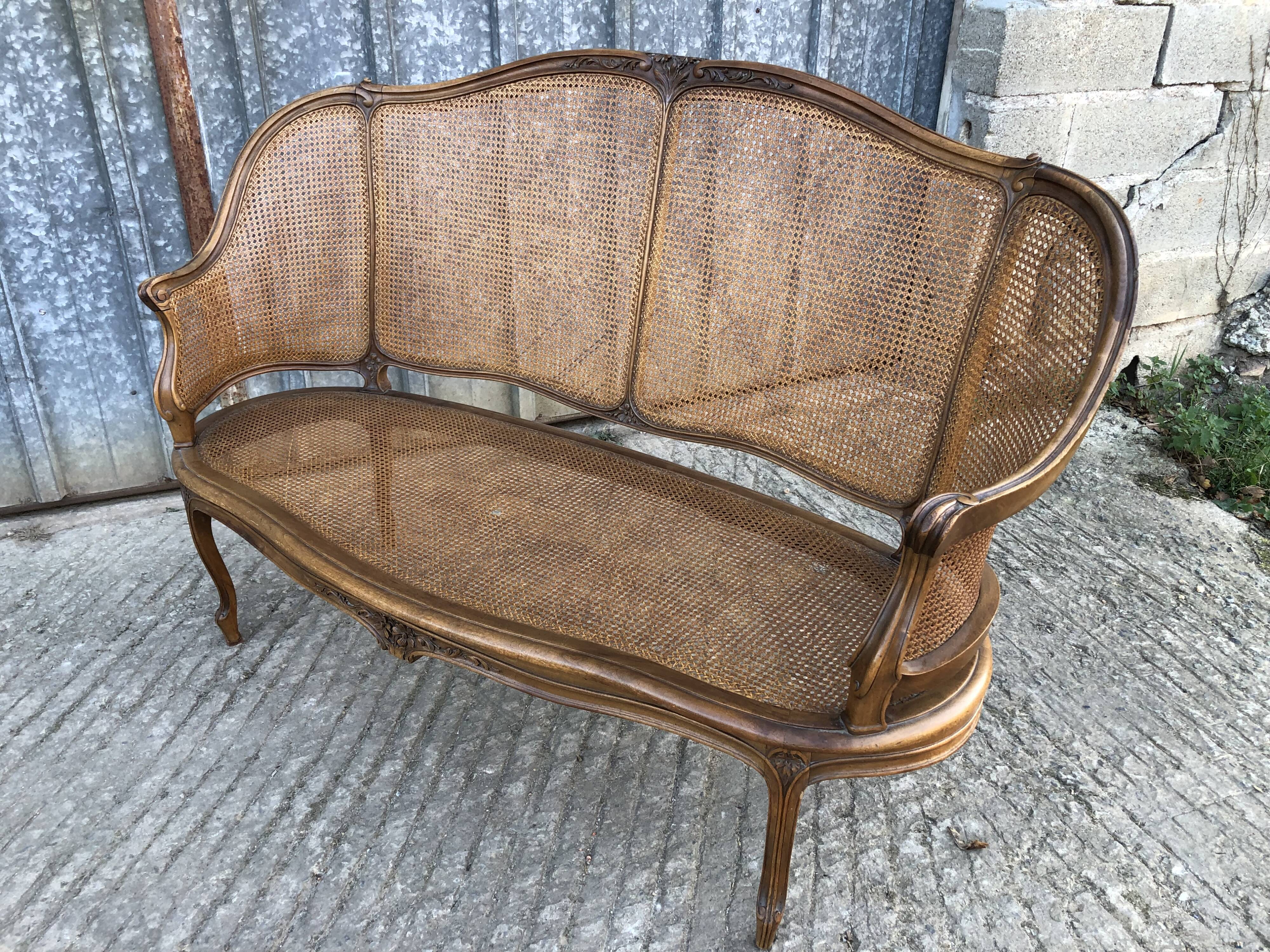 Antique Louis XV bench in solid walnut and caning