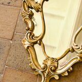 Antique Baroque mirror with gilded metal panels