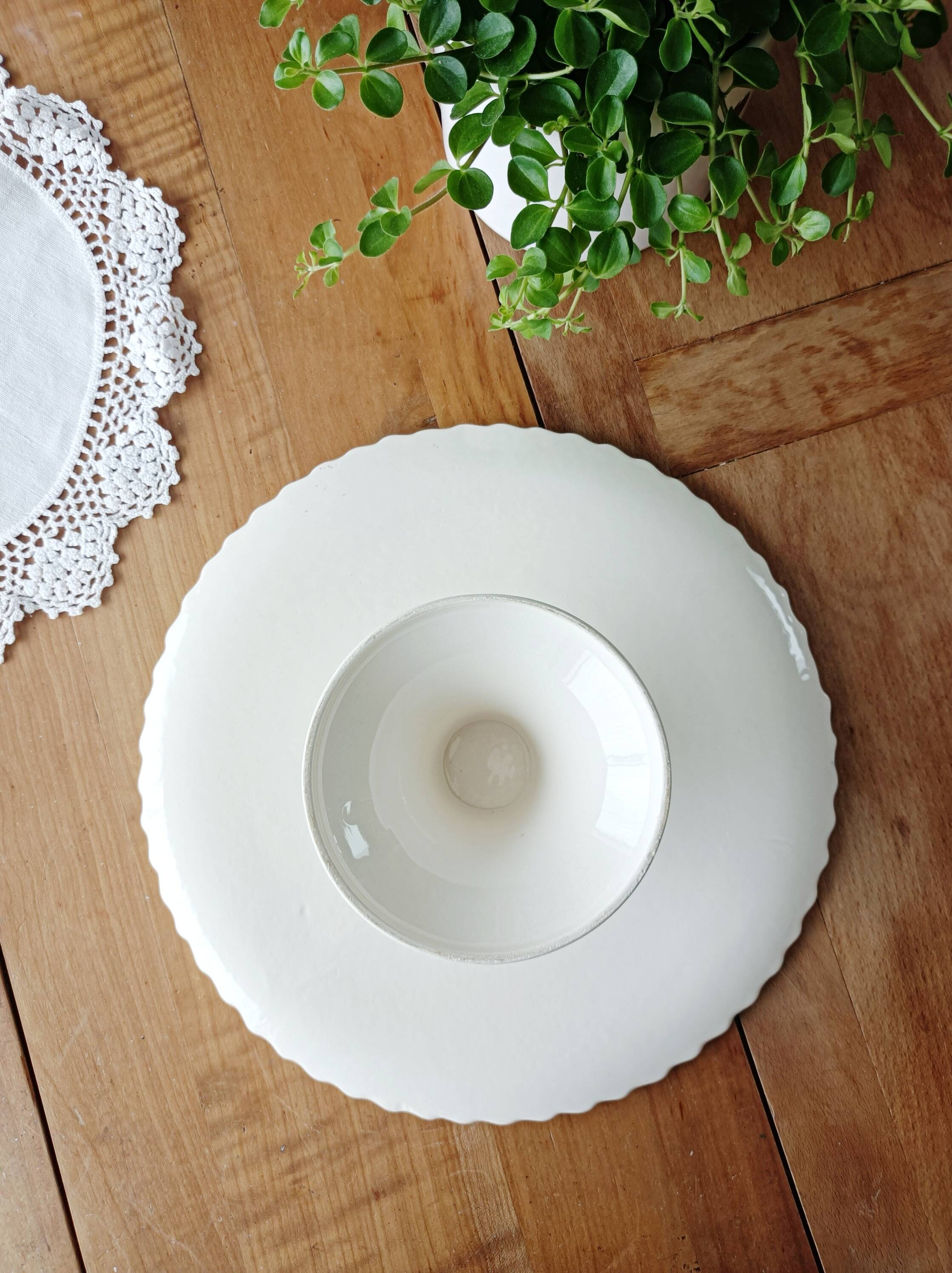 Pie dish on foot, in slip with blackberry decoration
