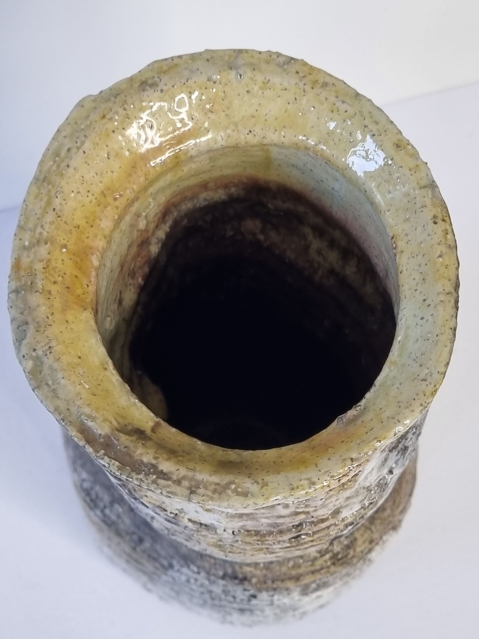 Enamelled ceramic roll vase