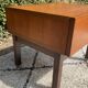 Vintage bedside table from the 60s-70s in teak.