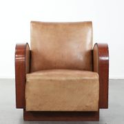 Art Deco design armchair in light cognac cowhide leather.