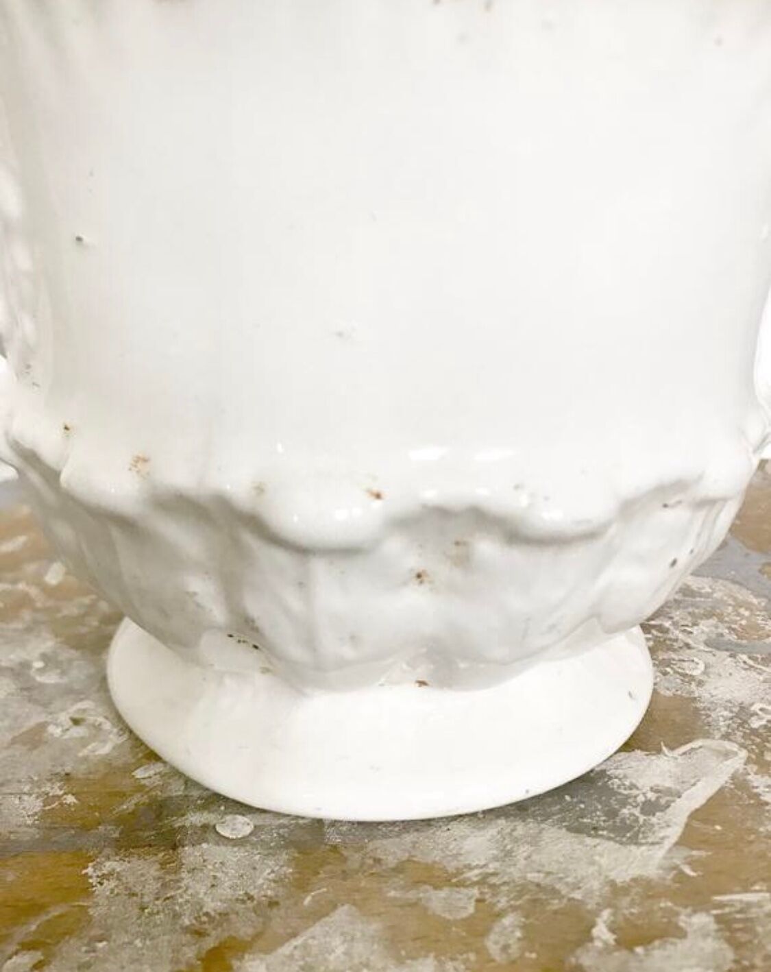 Vintage covered pot in white earthenware molded with lions and friezes